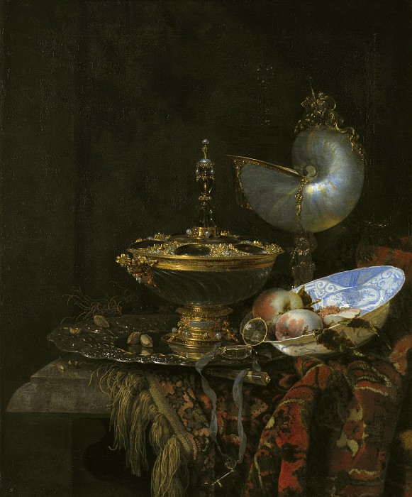 威廉·卡尔夫（Willem Kalf）–带有霍尔拜因碗，鹦鹉螺杯，玻璃酒杯和果盘的普罗克静物画